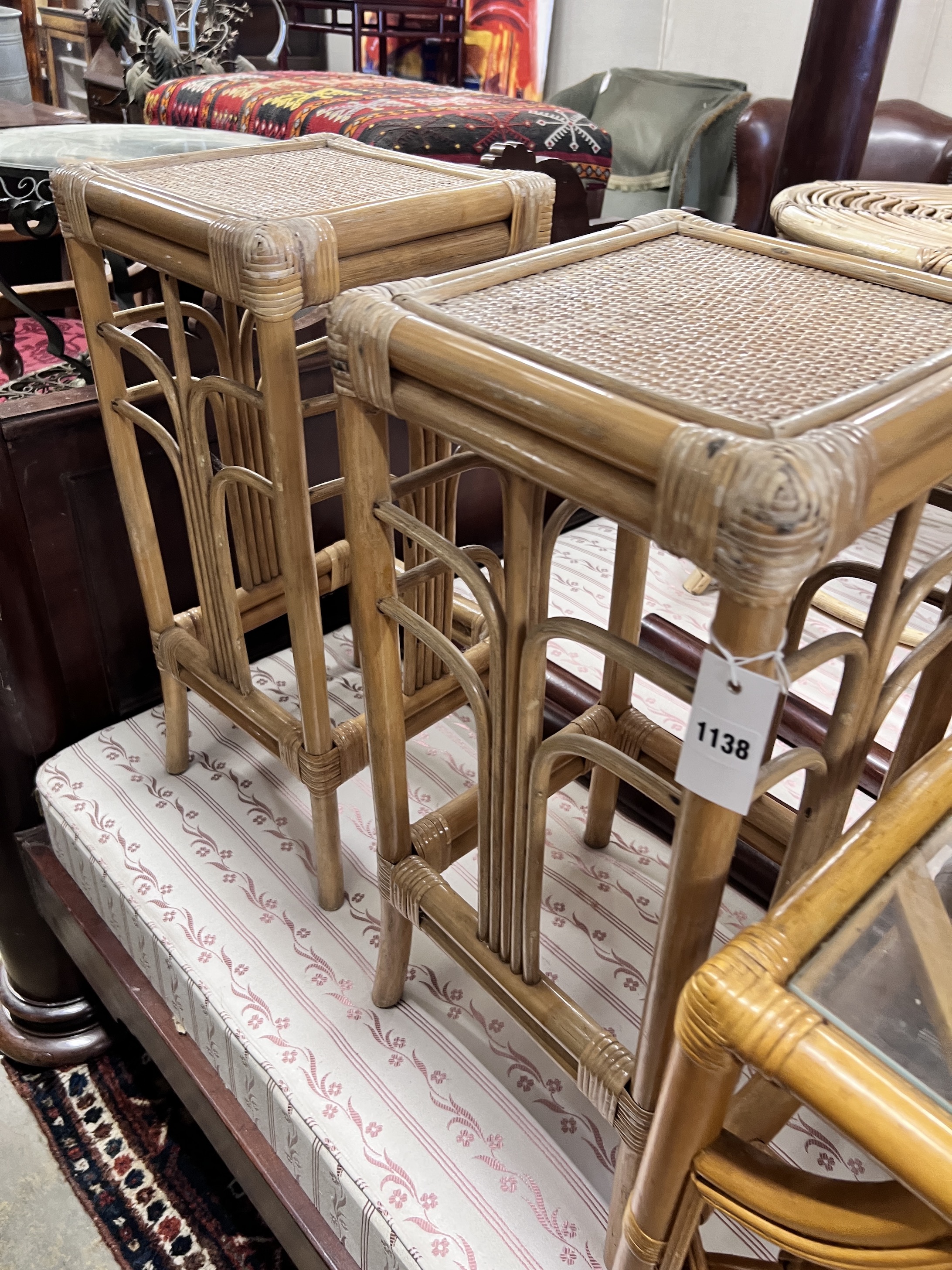 A Franco Albini rocking chair with coffee table, two side tables and a pair of plant stands